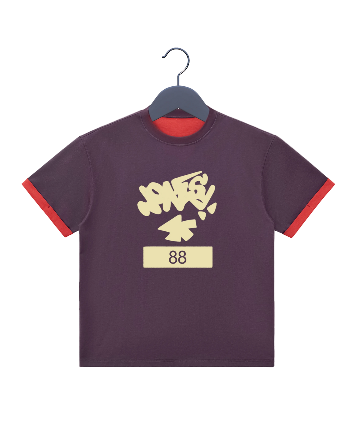 A dark purple ringer t-shirt with red trim on the sleeves and collar, featuring a cream-colored graffiti-style graphic that reads 'JONESYa+' above the number '88' on a cream block.